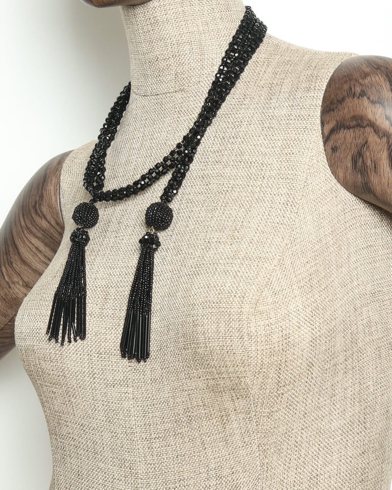 Vintage Bottega Veneta Tassel Necklace in black beads, styled on a mannequin to showcase the lariat design.