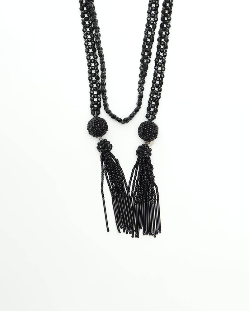 Vintage Bottega Veneta Tassel Necklace in black, showing the lariat style and dual beaded tassels against a white background.