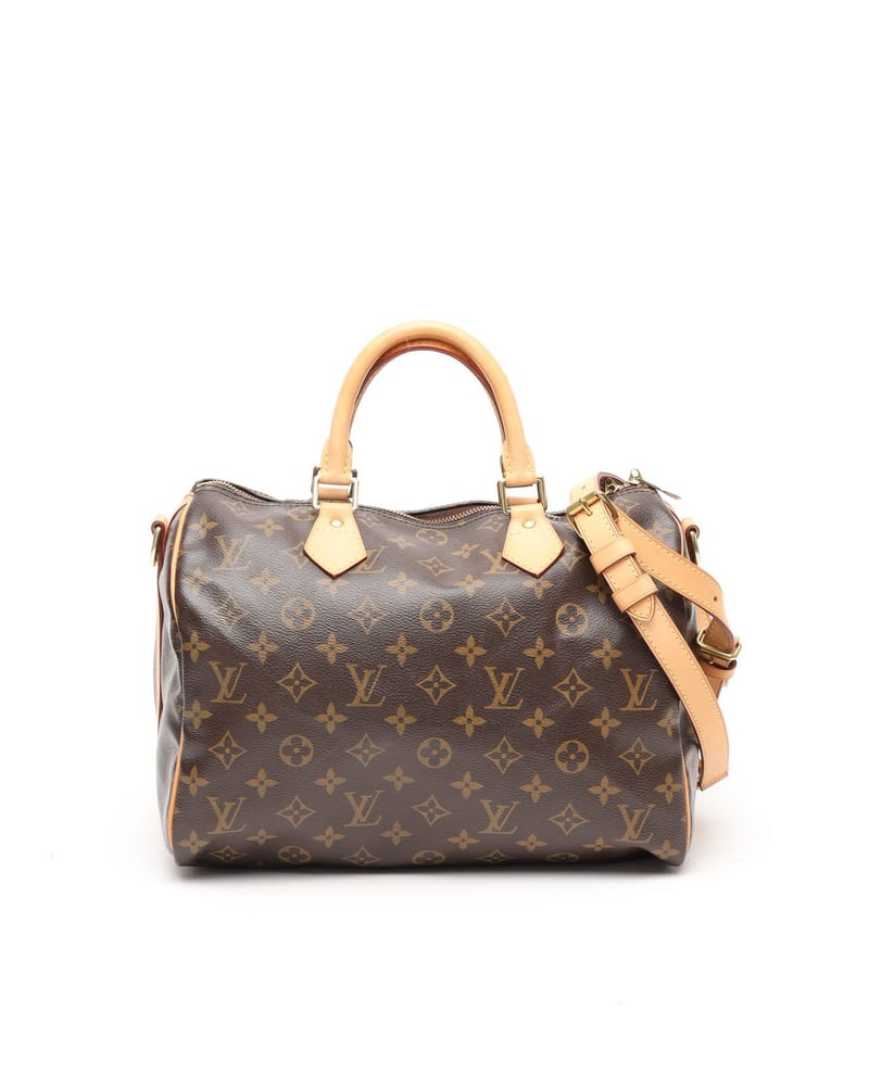 Vorderansicht der Vintage Louis Vuitton Monogram Speedy Bandoulière 35 Taschen mit Vachetta-Lederbesatz auf weißem Grund.