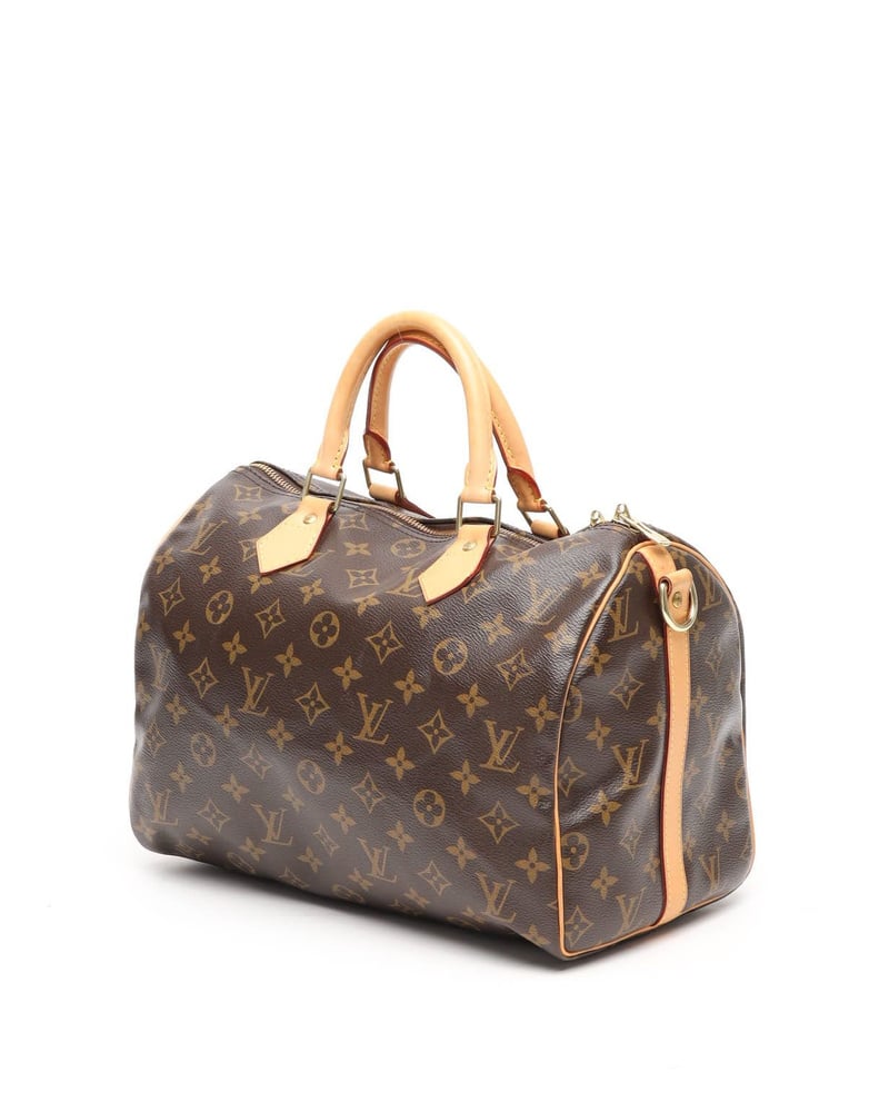 Seitenansicht der Louis Vuitton Monogram Speedy Bandoulière 35 Taschen aus braunem Canvas mit Vachetta-Lederbesatz.